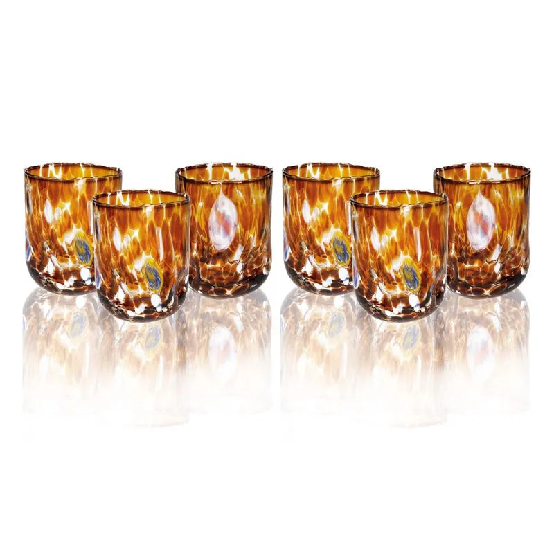 Set de 6 vasos de cristal de color ámbar, modelo Pavone, presentados juntos.