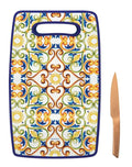 Tabla de cortar Medicis de acero inoxidable con acabado dorado y cuchillo a juego con detalles rosas.