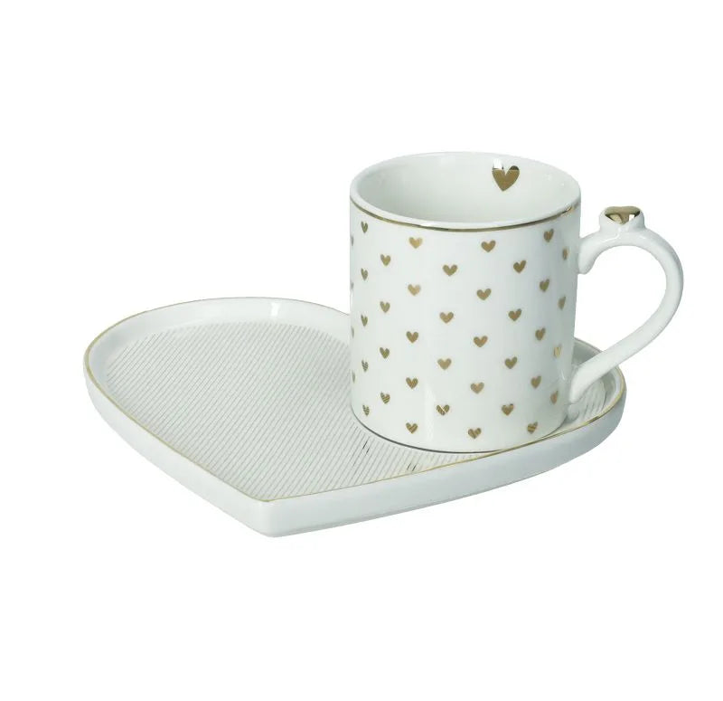 Taza con bandeja Amore Mio Righe, diseño de rayas blancas y rojas, sobre superficie clara.