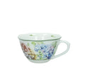 Taza de desayuno de cerámica blanca con motivos florales en tonos verdes y rosas, colección Flora de Brandani.