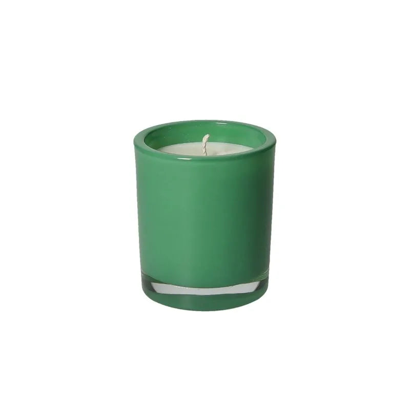 Vela perfumada Brandani de color verde con aroma a Gelsomino, presentada en su empaque.